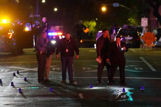 Authorities search area of the scene of a mass shooting with multiple deaths in Sacramento, Calif. Sunday, April 3, 2022. (AP Photo/Rich Pedroncelli)