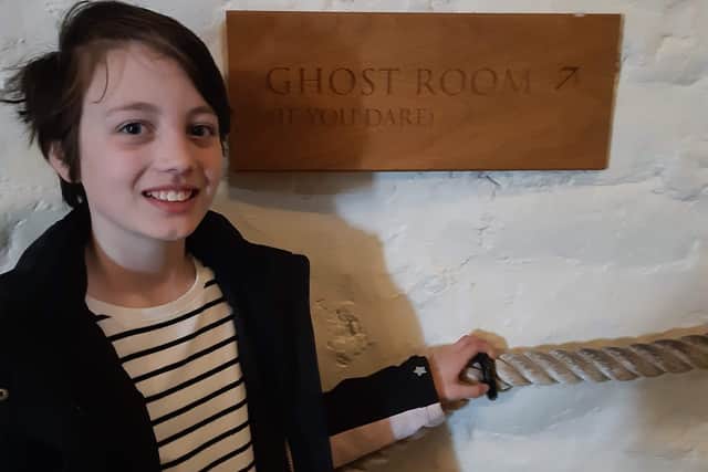 Lucy leads the way to the ghost room