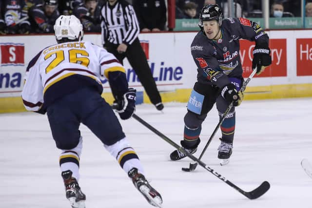 Belfast Giants’ Cam Knight with Guildford Flames’ Mike Crocock on Sunday in Belfast