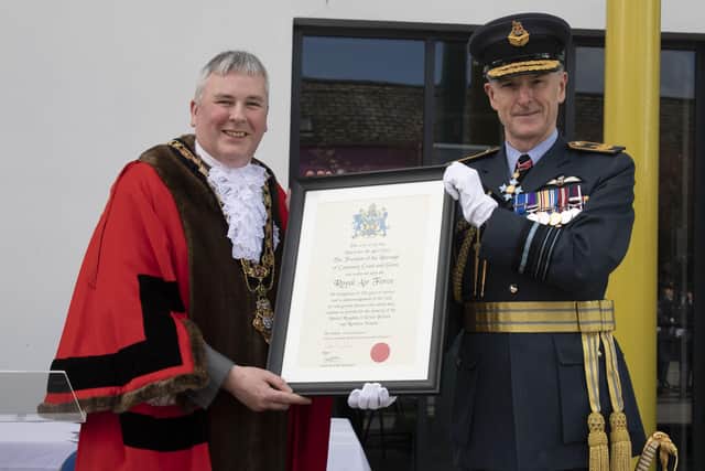 The Mayor, Cllr Richard Holmes presents a ceremonial certificate to the RAF’s Deputy Commander Operations, Air Marshal Sir Gerry Mayhew KCB CBE