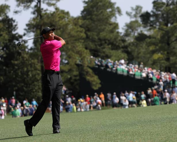 Tiger Woods plays his shot on the second hole during the first round of the Masters