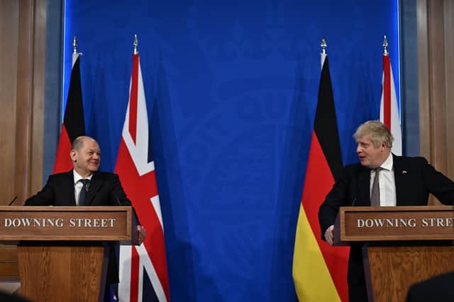 Appearing alongside the German leader Olaf Scholz at a Downing Street press conference, Boris Johnson said he could not rule out triggering Article 16