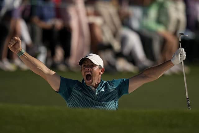 Rory McIlroy reacts after holing out from the bunker for a birdie during the final round at the Masters golf tournament on Sunday, April 10, 2022, in Augusta, Ga. (AP Photo/David J. Phillip)