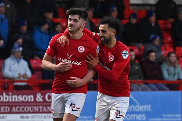 Lee Bonis is congratulated by Navid Nasseri after opening the scoring against Coleraine