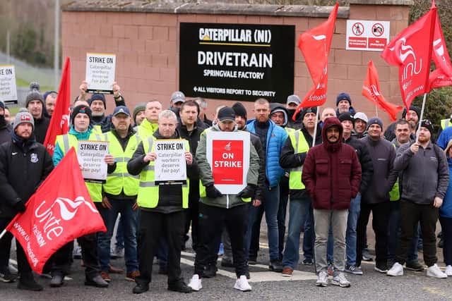 Caterpillar NI employees and Unite union members form a picket at the company's west Belfast plant on April 11. 

Picture: Jonathan Porter/PressEye