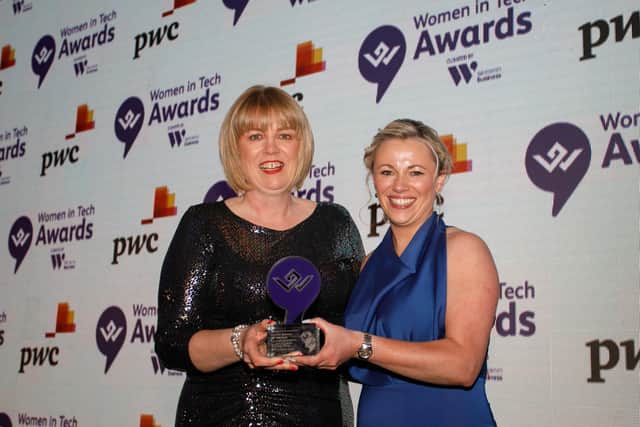Teresa Horgan collects the C Level Woman of the Year award on behalf of Mary Scullion. She is pictured with Louise Black, PwC UK, sponsors of the award