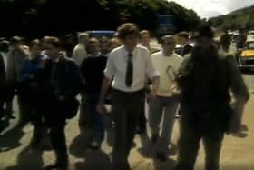 Jim Wells had made a very different trip to Co Louth in the 1980s. He is seen above, in white shirt and tie, at the border after being in Drogheda for the August 1986 court appearance for Peter Robinson, after the loyalist invasion of Clontibret. Image taken from RTE
