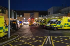 Ambulances are often put out of action because they cannot hand over their patient. In this library picture, ambulances at the entrance to the emergency department at Antrim Area Hospital are seen with a number of the vehicles with patients awaiting to be admitted
