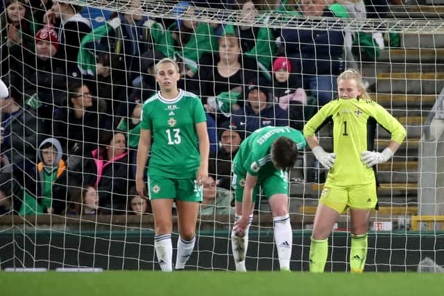 Defeated Northern ireland players after one of the goals they conceded against England