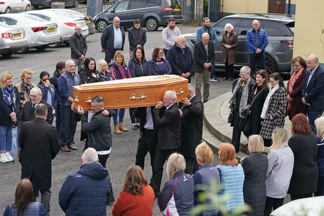 Pallbearers carry the coffin of Jody Keenan out of the Church of the Assumption, Drumalane, following the funeral of the 39-year-old teaching assistant who died while waiting for an ambulance crew to arrive in Newry.