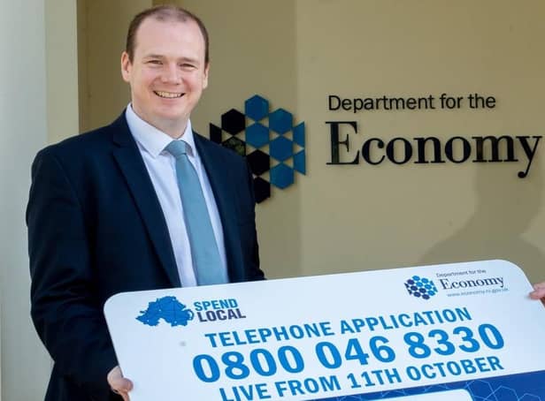 Stormont's Economy minister Gordon Lyons publicising the Spend Local card last year. Surveys conducted for the Economy Department in autumn 2021 indicated that over two-fifths of respondents intended to use the cards to buy things they were going to buy anyway