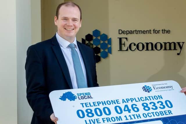 Stormont's Economy minister Gordon Lyons publicising the Spend Local card last year. Surveys conducted for the Economy Department in autumn 2021 indicated that over two-fifths of respondents intended to use the cards to buy things they were going to buy anyway