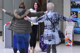 Back home for Easter:  Eimear Walsh arrives in George Best Belfast City Airport yesterday after being in Sydney, Australia for the last three years. She is greeted by her sister Dearbhaile and mum Rosemary. 
Picture by Arthur Allison/Pacemaker Press.