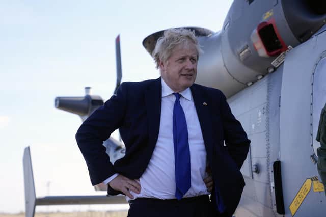 In recent weeks Boris Johnson has emerged from near political ruin to become one of the most prominent supporters of the Ukrainian resistance. Mr Johnson is photographed during a visit to Lydd airport in Kent where asylum seekers will be flown for processing to Rwanda