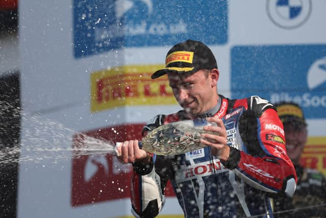 Honda Racing's Glenn Irwin celebrates victory at Silverstone.