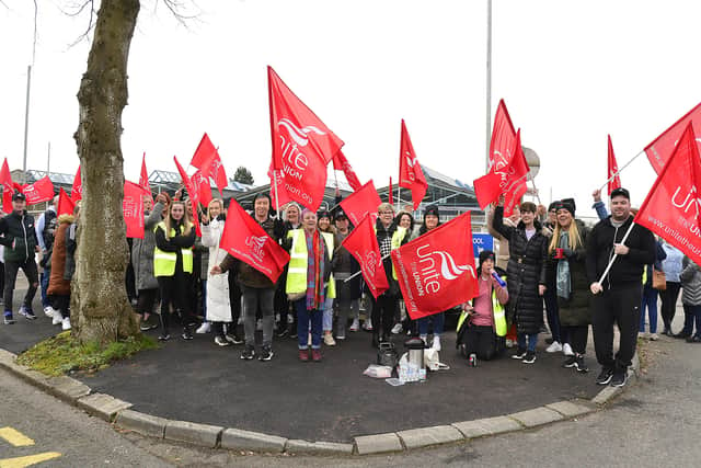Pacemaker Press 21-03-2022:   School bus disruption in Northern Ireland as Unite members strike begins. 
Some school transport, meals and council bin collections will be disrupted by a week-long strike from Monday.
More than 2,000 members of the Unite union are taking strike action in a dispute over pay. Staff pictured on strike outside Glenveagh Special School in south Belfast.
Picture By: Arthur Allison/Pacemaker Press.