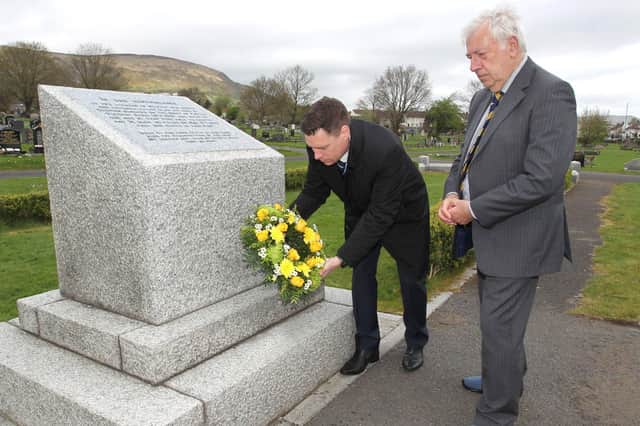 Alistair White and Ian Wilson, Chairman of the Northern Ireland War Memorial, lay a wreath on the mass grave of Blitz victims in Belfast City Cemetery on Friday April 15 2022.Photo:Peter O'Hara Photography