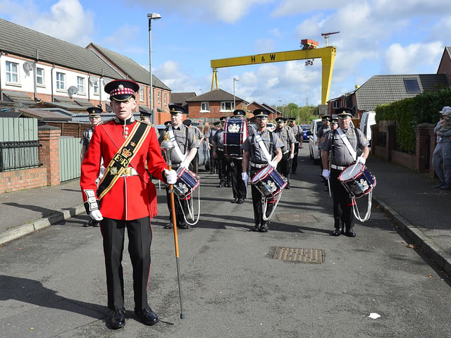 Pacemaker Press 18-04-2022:  Traffic disruption is expected in Belfast on Easter Monday due to parades taking place across the city. Delays can be expected on April 18 and again on Tuesday, April 19. Ballymacarrett Defenders pictured walking from Pitt Place and on to the Newtownards Road, in East Belfast.Picture By: Arthur Allison/Pacemaker Press.