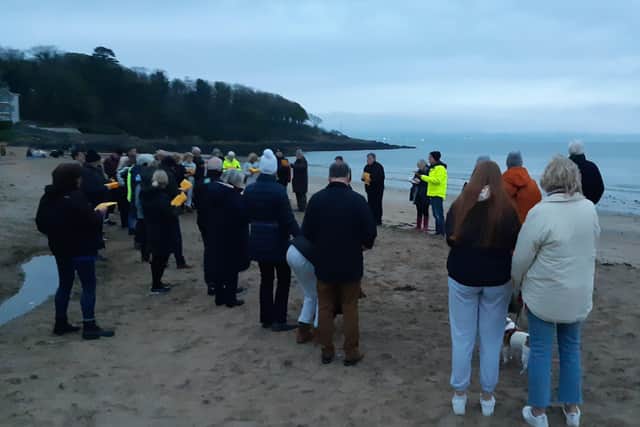 A joint Presbyterian and Church of Ireland dawn service on the beach at Helen's Bay, which began at 610am as the sun rose (albeit mostly obscured by cloud) across Belfast Lough in the background. Easter Sunday, April 17 2022