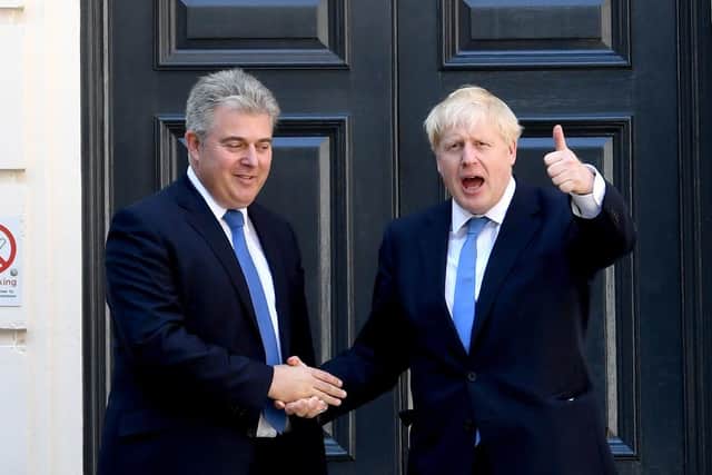 Leader of the Conservative party Boris Johnson (right) with Secretary of State for NI Brandon Lewis. Photo: Stefan Rousseau/PA Wire