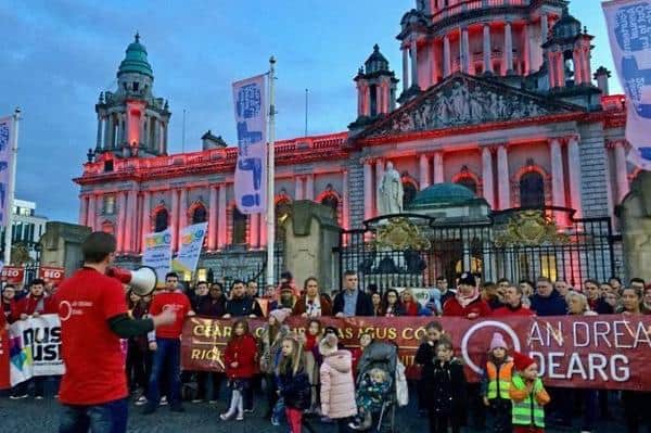 Belfast City Hall was illuminated red for an Irish language rights protest in January 2019. Photo: David Young/PA Wire
