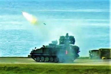 A Stormer armoured vehicle, pictured at the split-second when a missile has just left one of its launch tubes