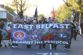 People take part in an anti Northern Ireland Protocol parade and rally in Grand Parade, east Belfast