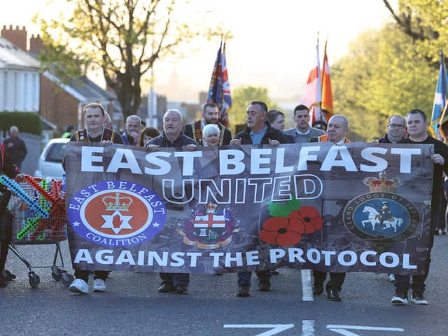 People take part in an anti Northern Ireland Protocol parade and rally in Grand Parade, east Belfast