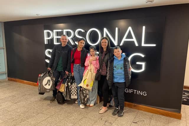 Nicole with her family enjoying her shopping spree