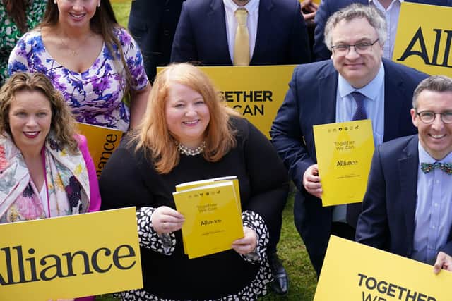 Alliance Party leader Naomi Long with some of her party's candidates at the launch of the Alliance Party Assembly 2022 election manifesto at CIYMS in Belfast