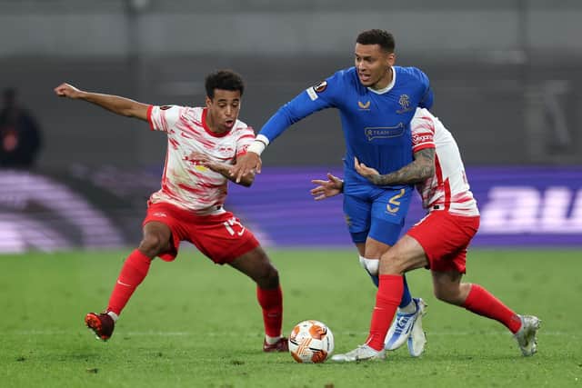 James Tavernier of Rangers is challenged by Tyler Adams and Angelino of RB Leipzig during the UEFA Europa League semi-final first-leg