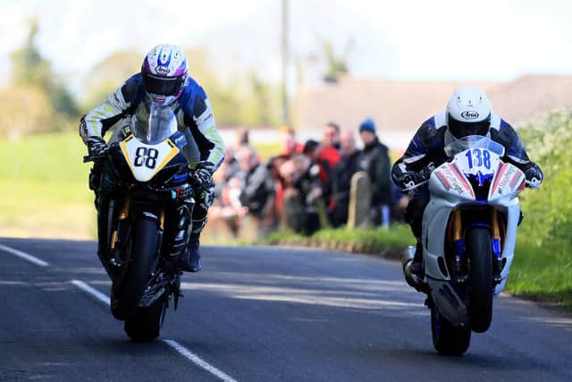 Forest Dunn (left) gets crossed up at the Tandragee 100 in 2019.
