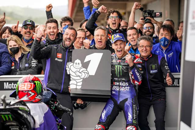 Monster Energy Yamaha's Fabio Quartararo celebrates victory in the Portuguese MotoGP race.