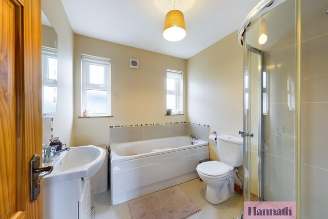 The family bathroom features a separate shower enclosure.