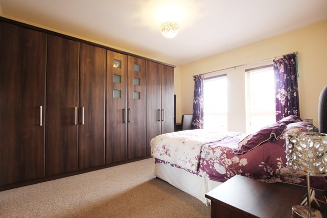The master bedroom boasts a large range of built-in wardrobes