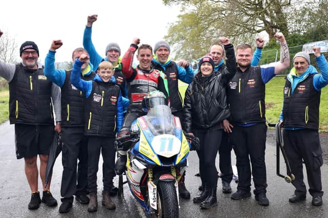 Dominic Herbertson celebrates his Supersport win at the Tandragee 100 on Saturday with the Burrows Engineering/RK Racing team.