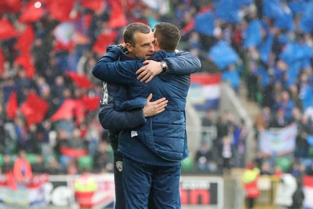 Coleraine boss Oran Kearney congratulates Linfield manager David Healy at the final whistle