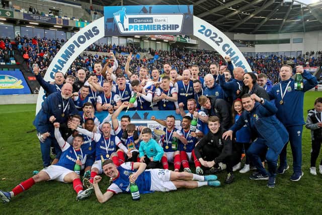 Linfield players and staff celebrate their league title win