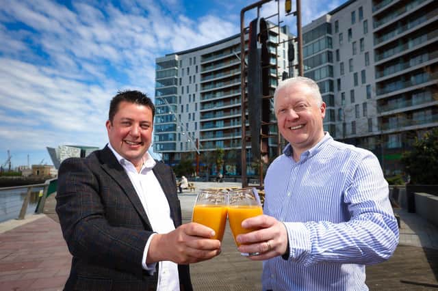 James Eyre, commercial director, Titanic Quarter and Andrew McQueen, managing director, Smoothie Factory UK & Ireland, toast the news that Smoothie Factory will open its first UK and Ireland store in Titanic Quarter