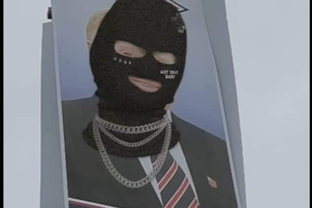 An image of Russell Watton wearing a balaclava with number 1 underneath