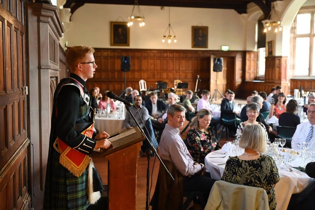 Drum Major Robbie Cooper, reads the Selkirk Grace during the Friends of the Campbell College Pipe Band, Burns Night Supper. Picture: Michael Cooper