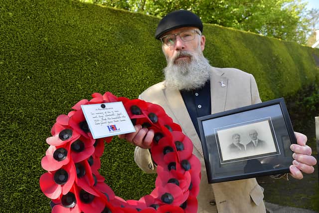 Neale Jagoe pictured with a photo of his great grandparents Willam and Elizabeth Jagoe from Co Cork and the wreath he laid in memory of the 13 boys and men murdered in the Bandon Valley Massacre they escaped. 
Picture By: Arthur Allison/Pacemaker Press.