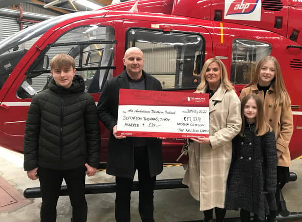 The Nelson family present a cheque to the Northern Ireland Air Ambulance