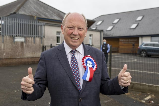 TUV leader Jim Allister give a thumbs up as he arrives at Kells and Connor Primary School, Ballymena