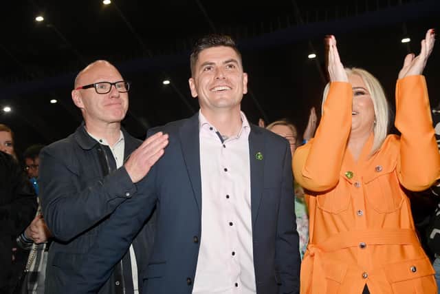 Sinn Fein’s Danny Baker (centre) was elected on the first count, sparking celebrations at the Titanic Belfast count centre.