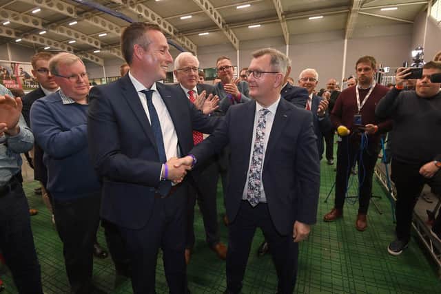 DUP leader Sir Jeffrey Donaldson is congratulated by party colleague Paul Givan.