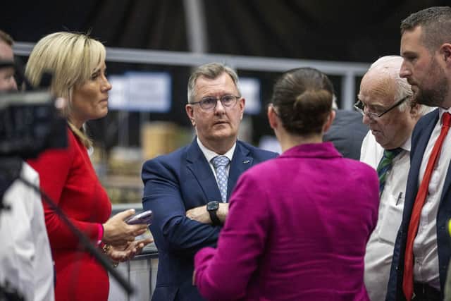 DUP's Diane Forsythe with party leader Sir Jeffrey Donaldson and supporters at the Titanic Exhibition Centre election count in Belfast on Saturday. Photo: Liam McBurney/PA Wire
