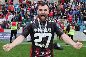 Crusaders’ cup hero Johnny McMurray celebrates with his winner's medal