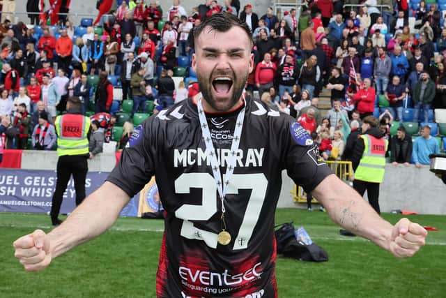 Crusaders’ cup hero Johnny McMurray celebrates with his winner's medal