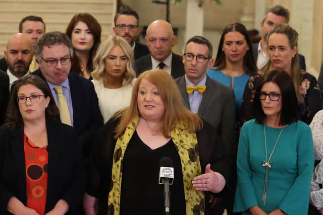 Alliance Party leader Naomi Long with her party's newly elected MLAs in the Great Hall of Parliament Buildings at Stormont.